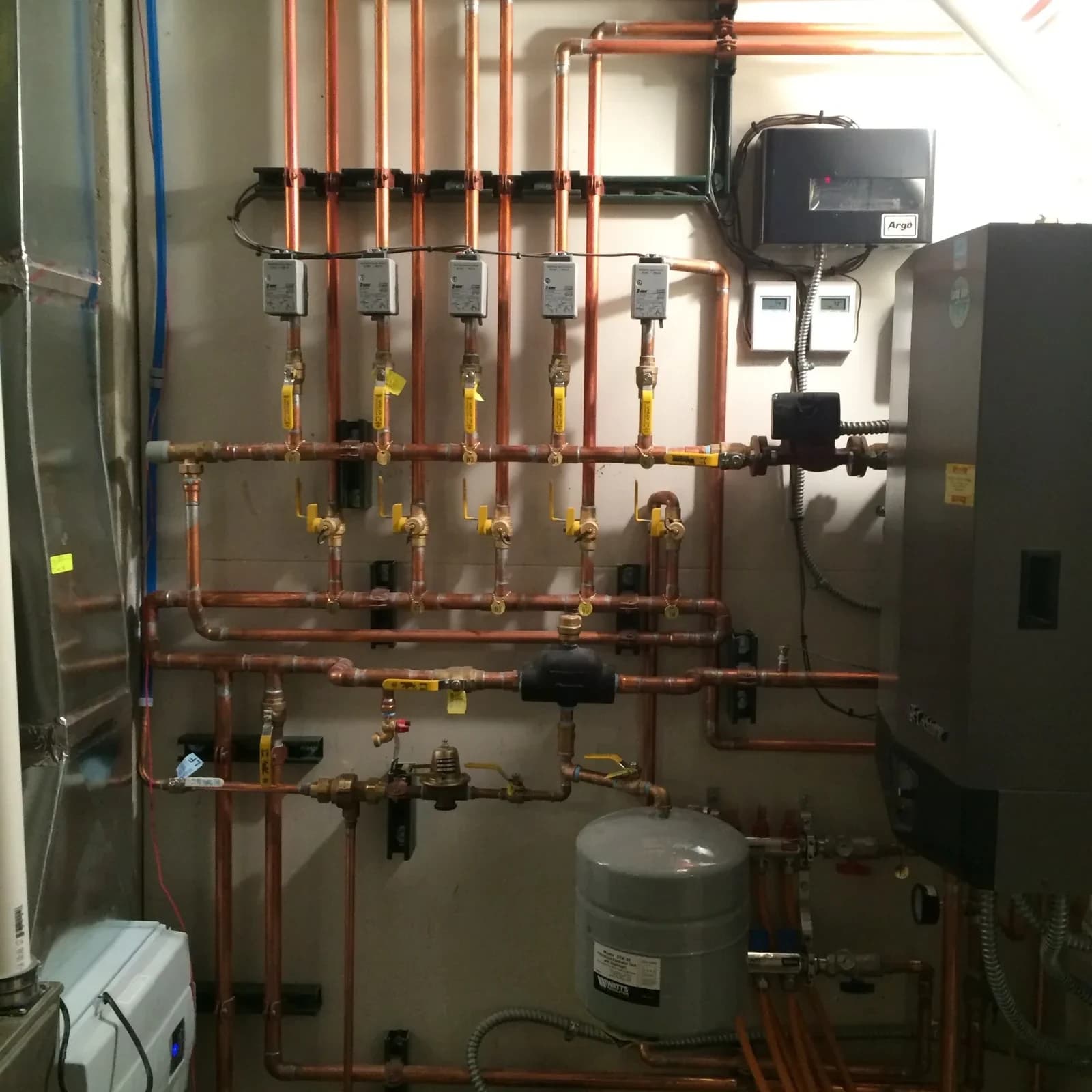 Boiler repair with copper piping manifold by Mazure's HVAC