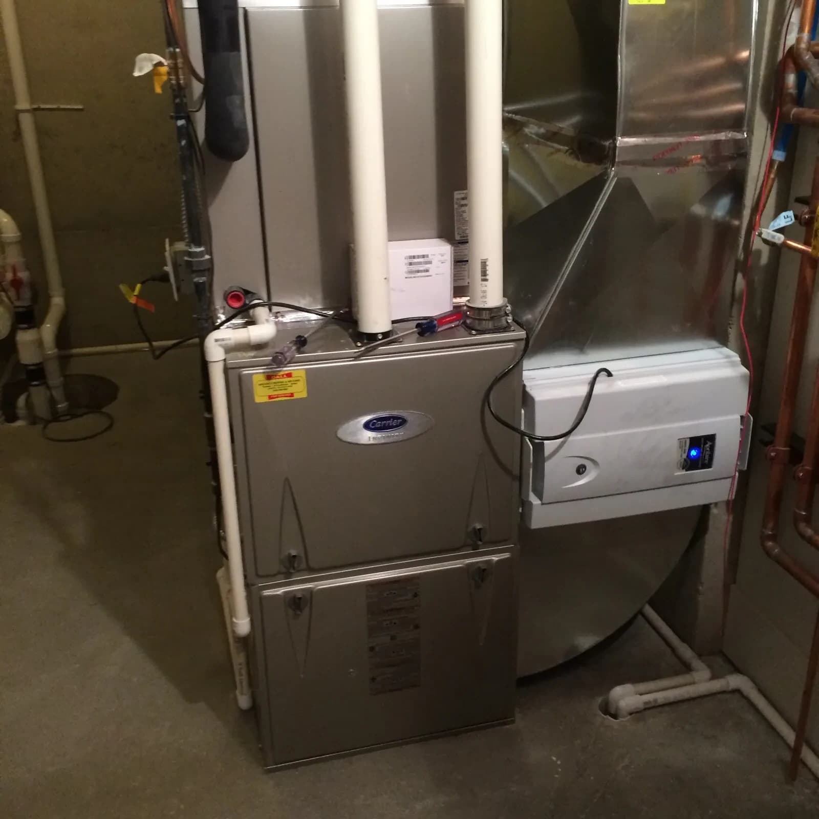 Carrier furnace with Aprilaire humidifier installed by Mazure's in a West Michigan home