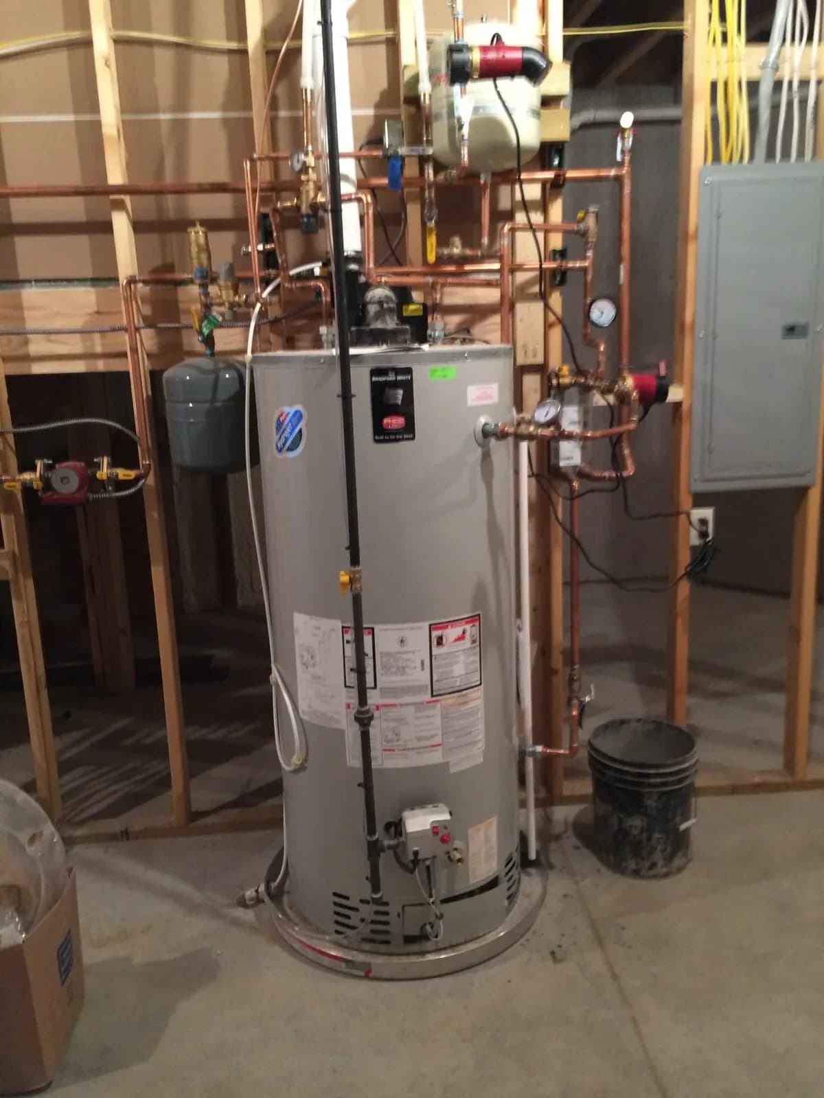 Tankless water heater installation with piping by Mazure's